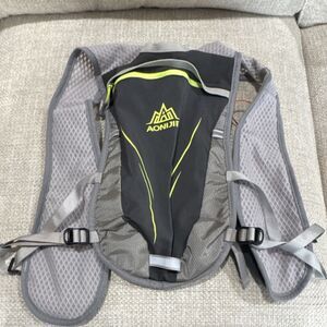 AONIJIE Hydration Pack Gray Black Yellow Strap Accents Lightweight Hiking